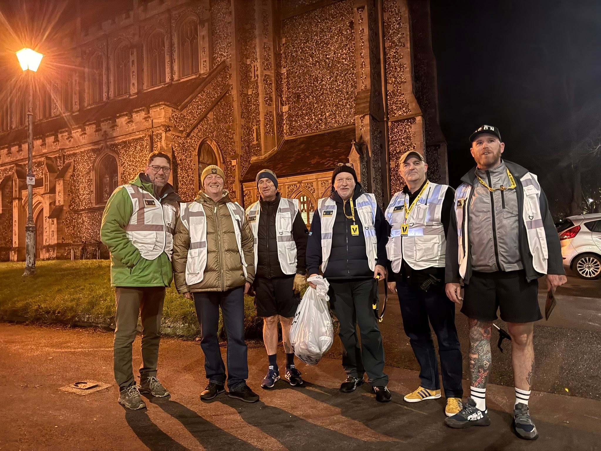 Protect Our Parks volunteers standing together at night in Portsmouth